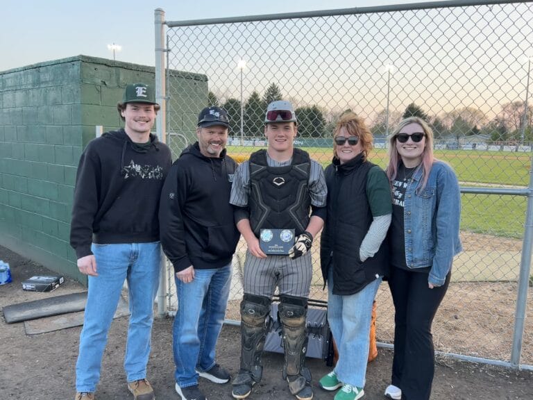 Photo of Anderson family at a baseball game.